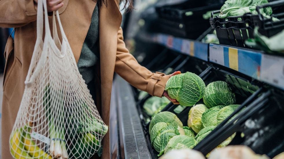 woman holding cabbage